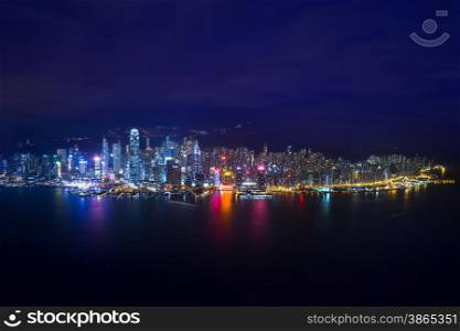 Night aerial view panorama of Hong Kong skyline and Victoria Harbor. Travel destinations