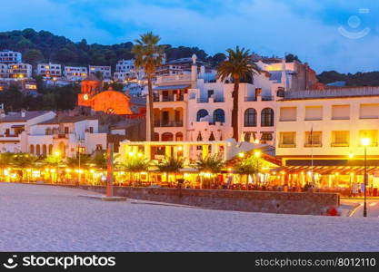Night beach and promenade with cafes and restaurants in Tossa de Mar on the Costa Brava, Catalunya, Spain