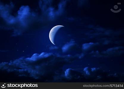Night blue cloudy sky with stars and a moon crescent-shaped
