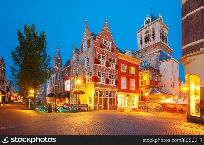 Night canal, typical dutch house, City Hall and Gothic Protestant Nieuwe Kerk, New church, in Delft, Holland, Netherlands