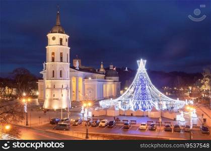 Night Christmas tree on Cathedral Square and Cathedral Belfry, Vilnius, Lithuania, Baltic states.. Christmas tree in Vilnius, Lithuania