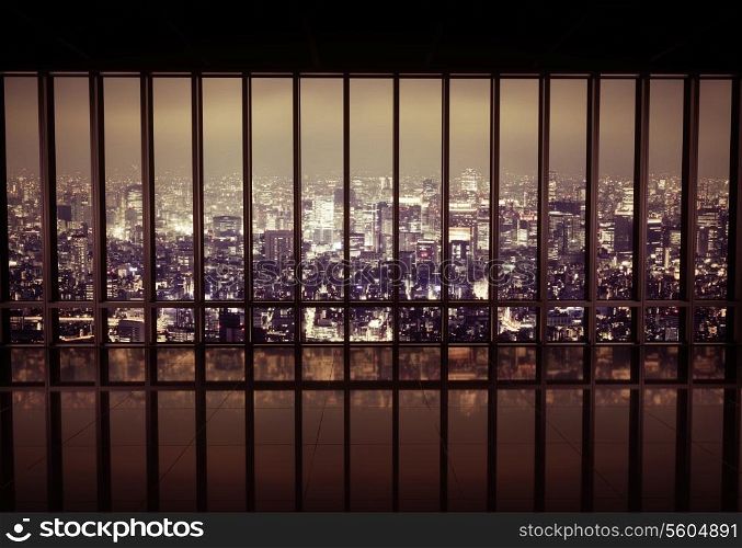 Night city behind the metal grating