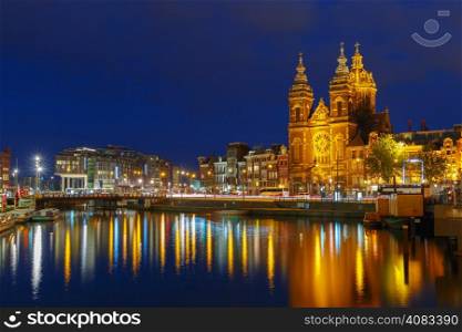 Night city view of Amsterdam canal and Basilica of Saint Nicholas, Holland, Netherlands. Long exposure.