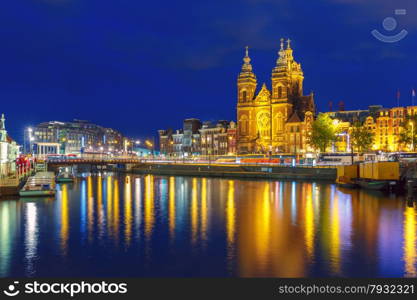 Night city view of Amsterdam canal and Basilica of Saint Nicholas, Holland, Netherlands. Long exposure.