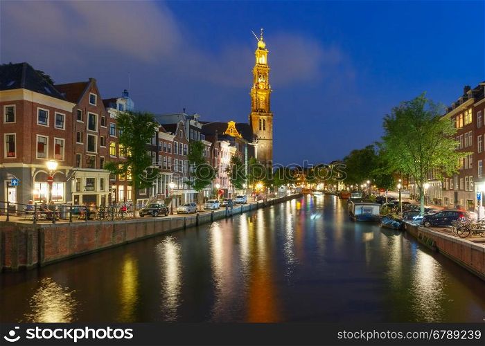 Night city view of Amsterdam canal and Westerkerk church, Holland, Netherlands.