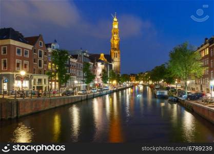 Night city view of Amsterdam canal and Westerkerk church, Holland, Netherlands.
