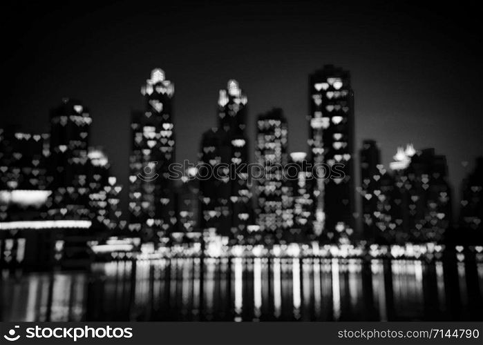 Night cityscape of Dubai. Defocused black and white shot with hearts shaped bokeh