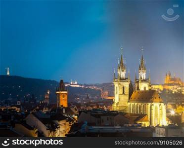 Night cityscape of Prague, Czech Republic. Famous Old town hall, Church Of Our Lady Before Tyn, St. Vitus Cathedral. Night cityscape of Prague, Czech Republic. Town hall, Church Of Our Lady Before Tyn, St. Vitus Cathedral