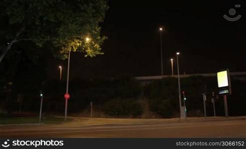 Night crossroads with small advertising board for your image or text.