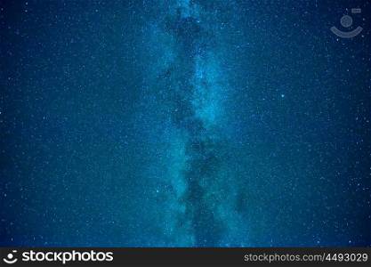 Night dark blue sky with many stars of milky way galaxy and flying satellite