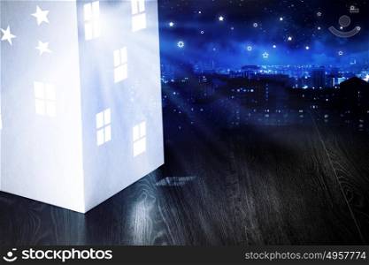 Night dreaming. Close up of model of paper house