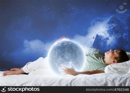 Night dreaming. Cute boy sleeping in bed with moon
