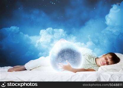 Night dreaming. Cute boy sleeping in bed with moon