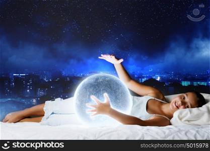 Night dreaming. Cute girl sleeping in bed with moon