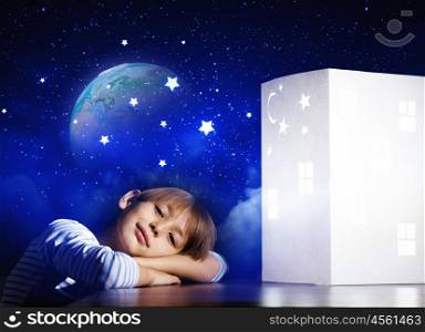Night dreaming. Cute little boy sleeping and dreaming about home