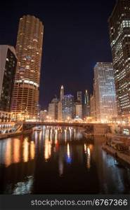 Night falls on the buildings and architecture of Chicago, Illinois