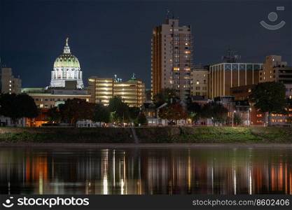 Night falls on the riverfront and capital building of Harrisburg Pennsylvania