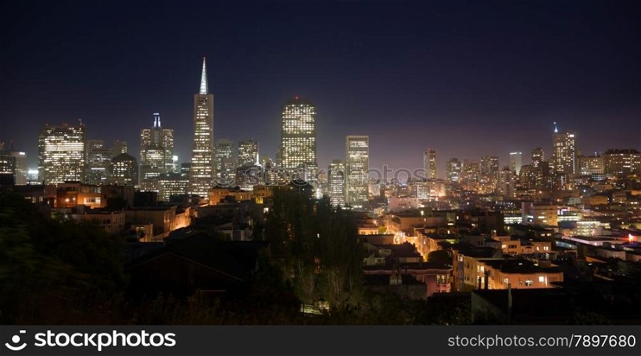 Night falls over the recognizable downtown skyline of San Francisco