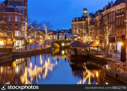 Night Leiden canal Oude Rijn in Christmas illumination, South Holland, Netherlands.. Christmas Leiden canal Oude Rijn