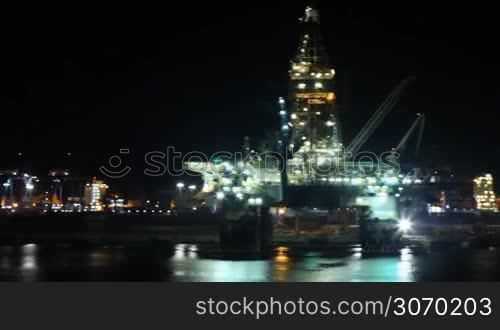 night lights illuminate the oil platform in port