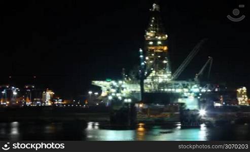 night lights illuminate the oil platform in port