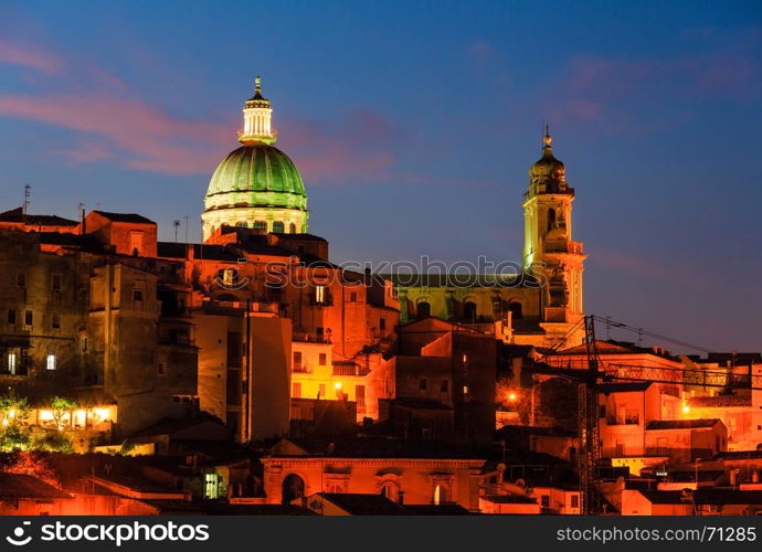 Night old medieval Ragusa Ibla famos Sicilian town view (Sicily, Italy). City lights of famous touristic destination. Unesco world heritage site.