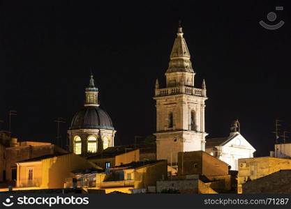 Night old medieval Ragusa Sicilian town view (Sicily, Italy). City lights of famous touristic destination. Unesco world heritage site.