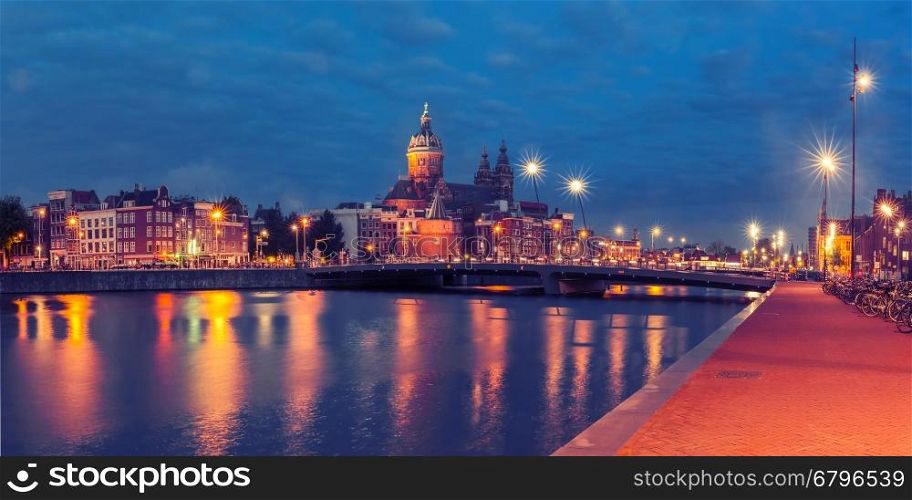 Night panoramic city view of Amsterdam canal, bridge and Basilica of Saint Nicholas, Holland, Netherlands. Long exposure. Used toning