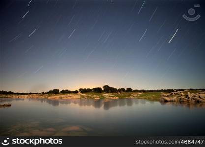 Night picture of a beautiful lake with stars in the sky