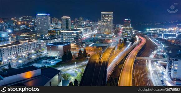 Night scene aerial view over the highway and buildings of downtown Tacoma Washington
