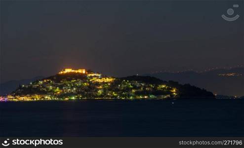 Night scene of Astros town with old ruined Castle of Zafeiropouloi, Greece Peloponnese Arcadia. Travel adventure concept. Night scene of Astros town with old castle Greece