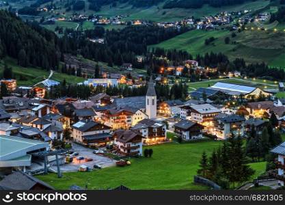 night scene of Corvara village in Badia Valley, Alto Adige, Italy