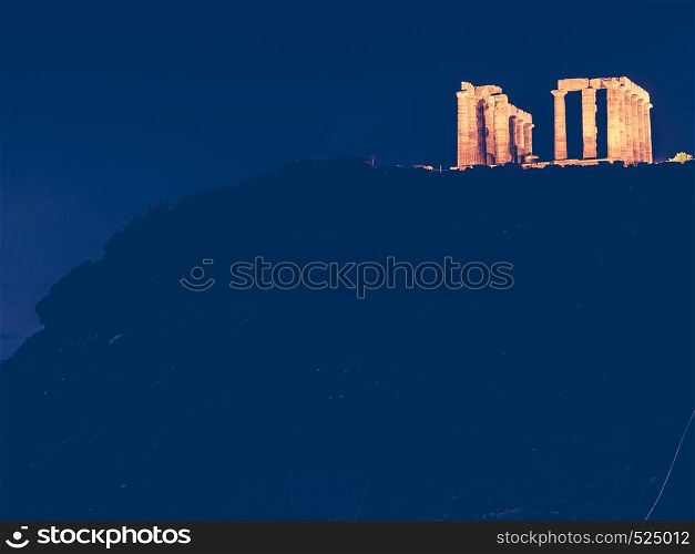 Night scene ruins of an ancient temple of Poseidon, Greek god of the sea. Greece Cape Sounion.. Greek temple of Poseidon at night, Cape Sounio