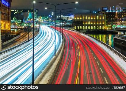 Night scenery of the Old Town (Gamla Stan) pier architecture with highway road transportation traffic in Stockholm, Sweden
