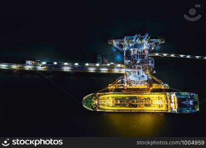 night shot oil tanker transport loading in oil station import and export business logistics transportation open sea top view