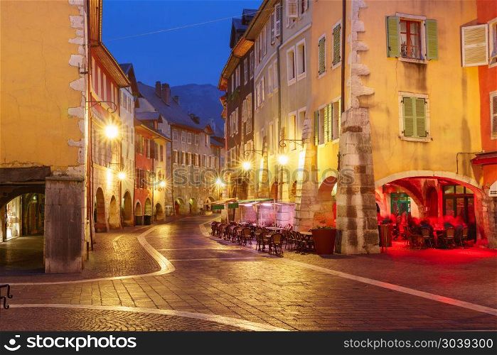 Night street in Old Town of Annecy, France. Nice street Rue Sainte-Claire in Old Town of Annecy at rainy night, France