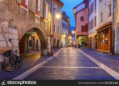 Night street in Old Town of Annecy, France. Nice street Rue Sainte-Claire in Old Town of Annecy at rainy night, France