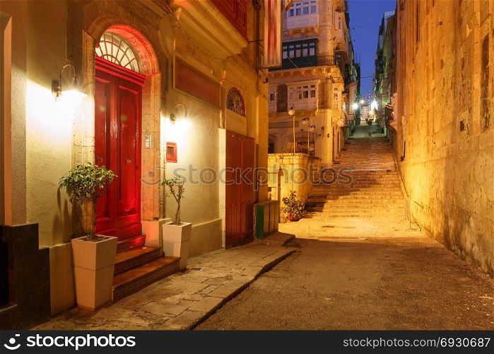 Night street in old town of Valletta, Malta. Typical Maltese medieval street at night in the center of the Old Town of Valletta, Malta