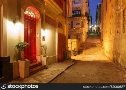Night street in old town of Valletta, Malta. Typical Maltese medieval street at night in the center of the Old Town of Valletta, Malta