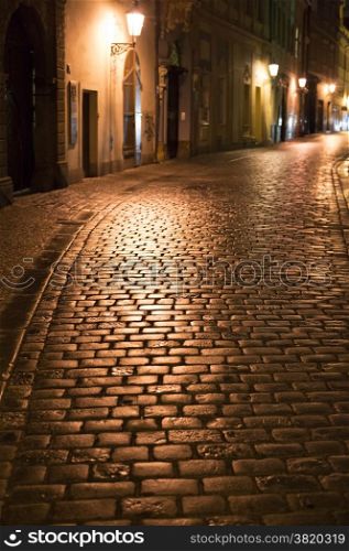 Night street in Prague. Czech Republic. Sharpness on a cobblestones