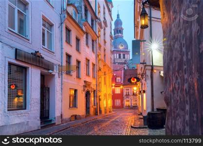 Night street in the Old Town of Riga, Latvia. Typical europeen medieval street and the Cathedral of Saint Mary in the morning, Riga, Latvia