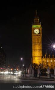 Night time photograph of the famous landmark clock tower known as Big Ben in Parliament Square, London, England, part of the Palace of Westminster also known as the Houses of Parliament.