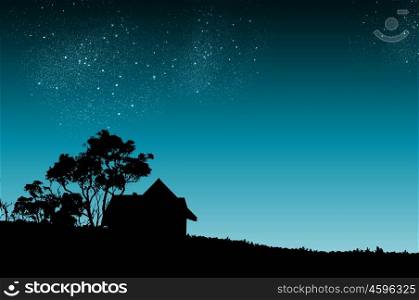 Night time. Silhouette of countryside house and trees at night