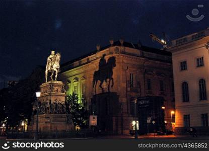 Night time view of lit up statue monument, Berlin