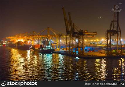 Night view of Barcelona industrial port. Spain