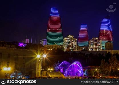 Night view of central business district with neon highlighted buildings and skyscrapers, Baku, Azerbaijan
