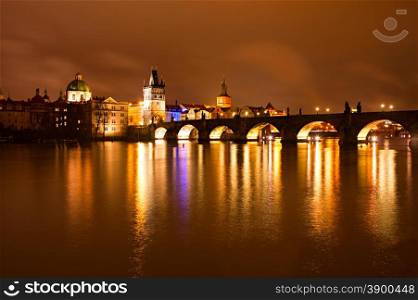 Night view of Charles bridge and Church of St. Francis. Prague, Czech Republic