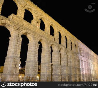 Night view of famous ancient aqueduct in Segovia, Castilla y Leon, Spain.