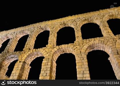 Night view of famous ancient aqueduct in Segovia, Castilla y Leon, Spain.