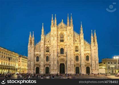 Night view of famous Milan Cathedral (Duomo di Milano) on piazza in Milan, Italy with stars on the blue dark sky